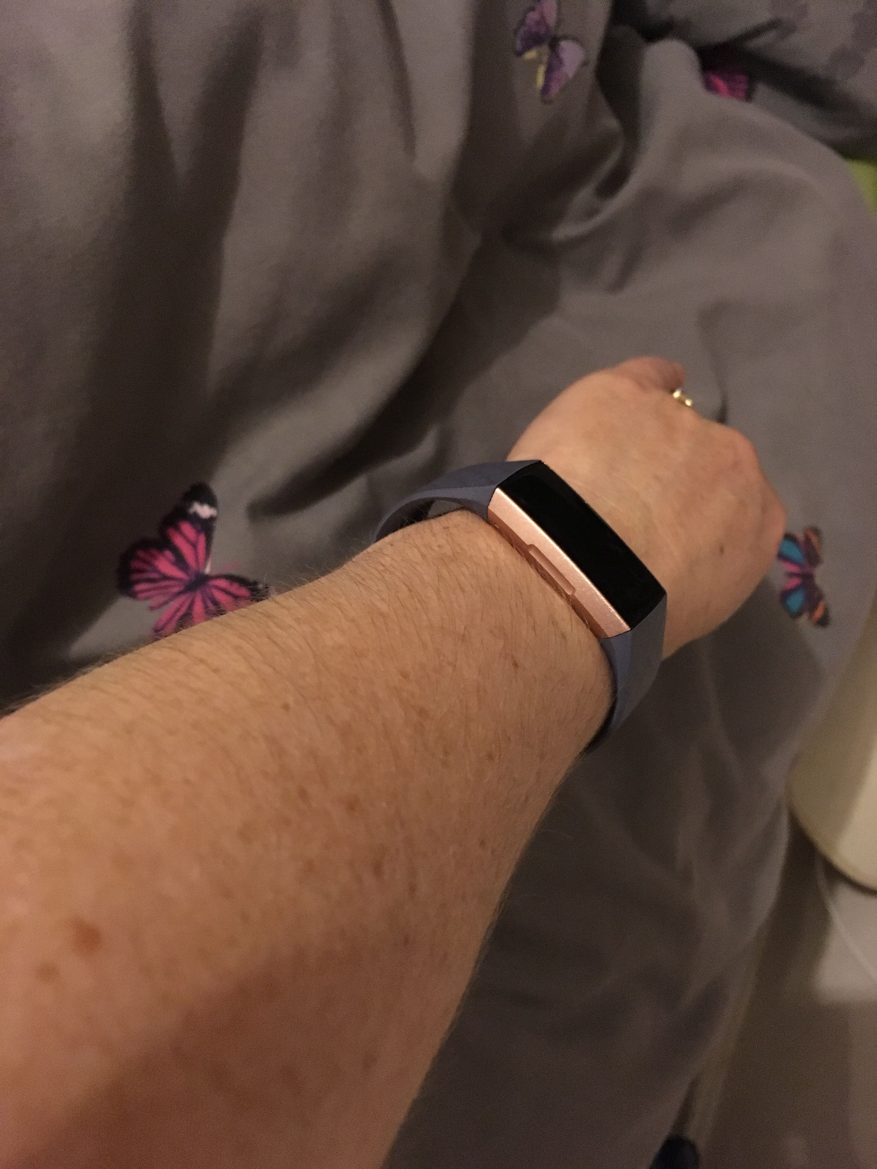 fitbit charge 3 on woman's wrist